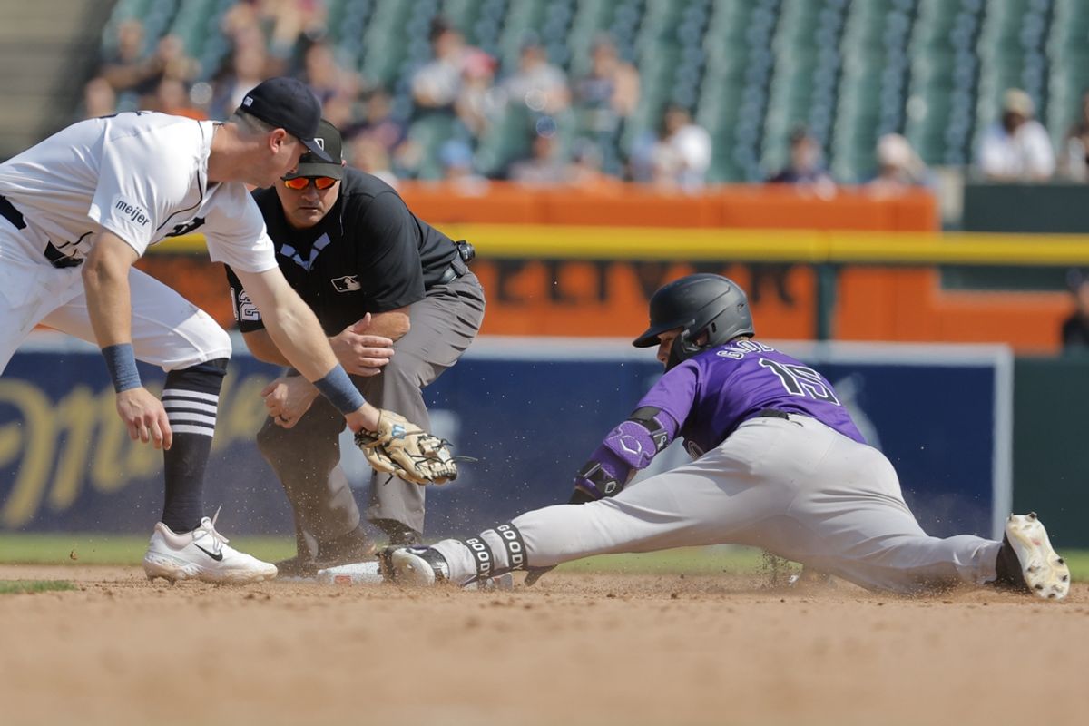 Sep 12, 2024; Detroit, Michigan, USA;  Colorado Rockies outfielder Hunter Goodman (15) slides in safe at second after he hits a double in the seventh inning against the Detroit Tigers at Comerica Park. Mandatory Credit: Rick Osentoski-Imagn Images