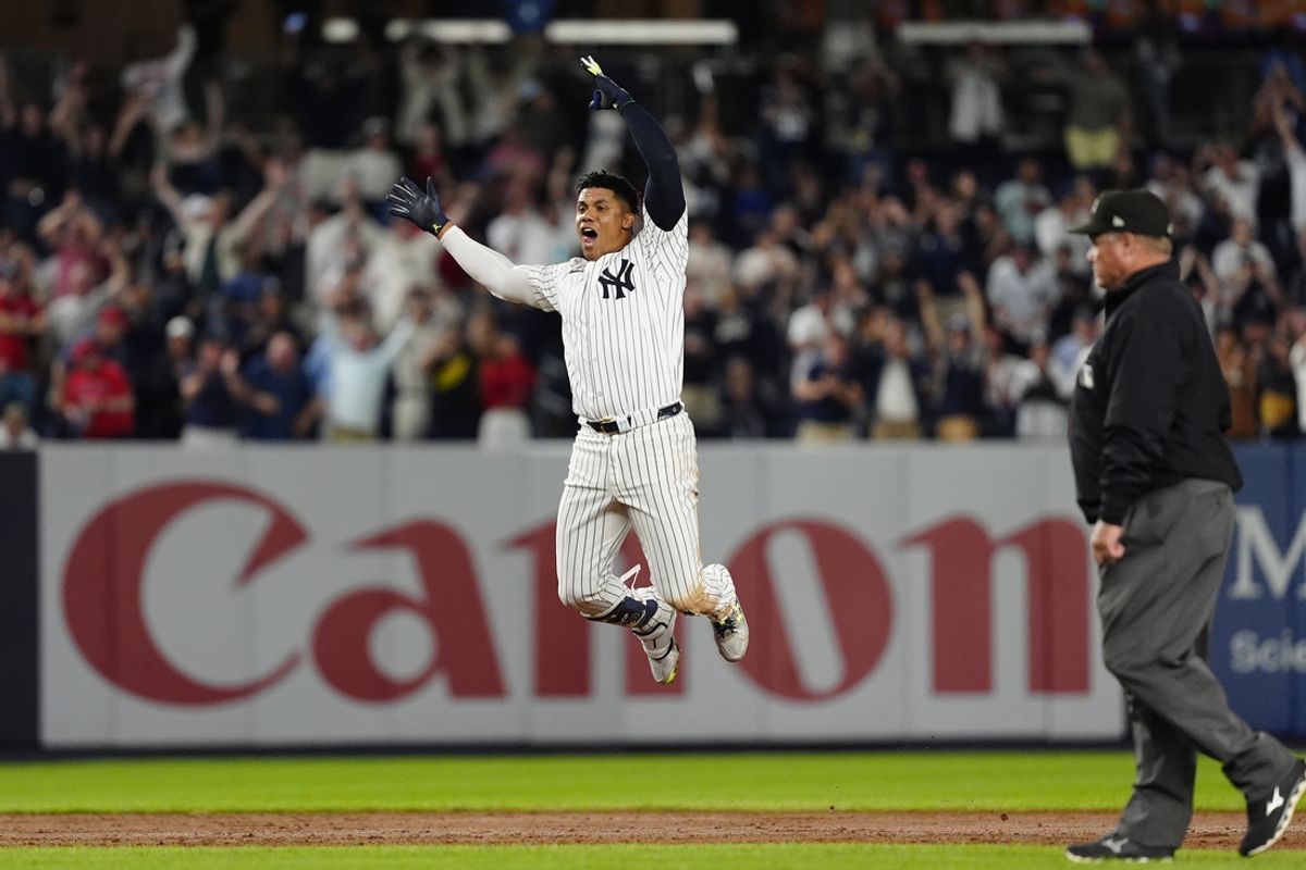Sep 12, 2024; Bronx, New York, USA; New York Yankees right fielder Juan Soto (22) reacts to getting the game winning hit against the Boston Red Sox during the tenth inning at Yankee Stadium. Mandatory Credit: Gregory Fisher-Imagn Images