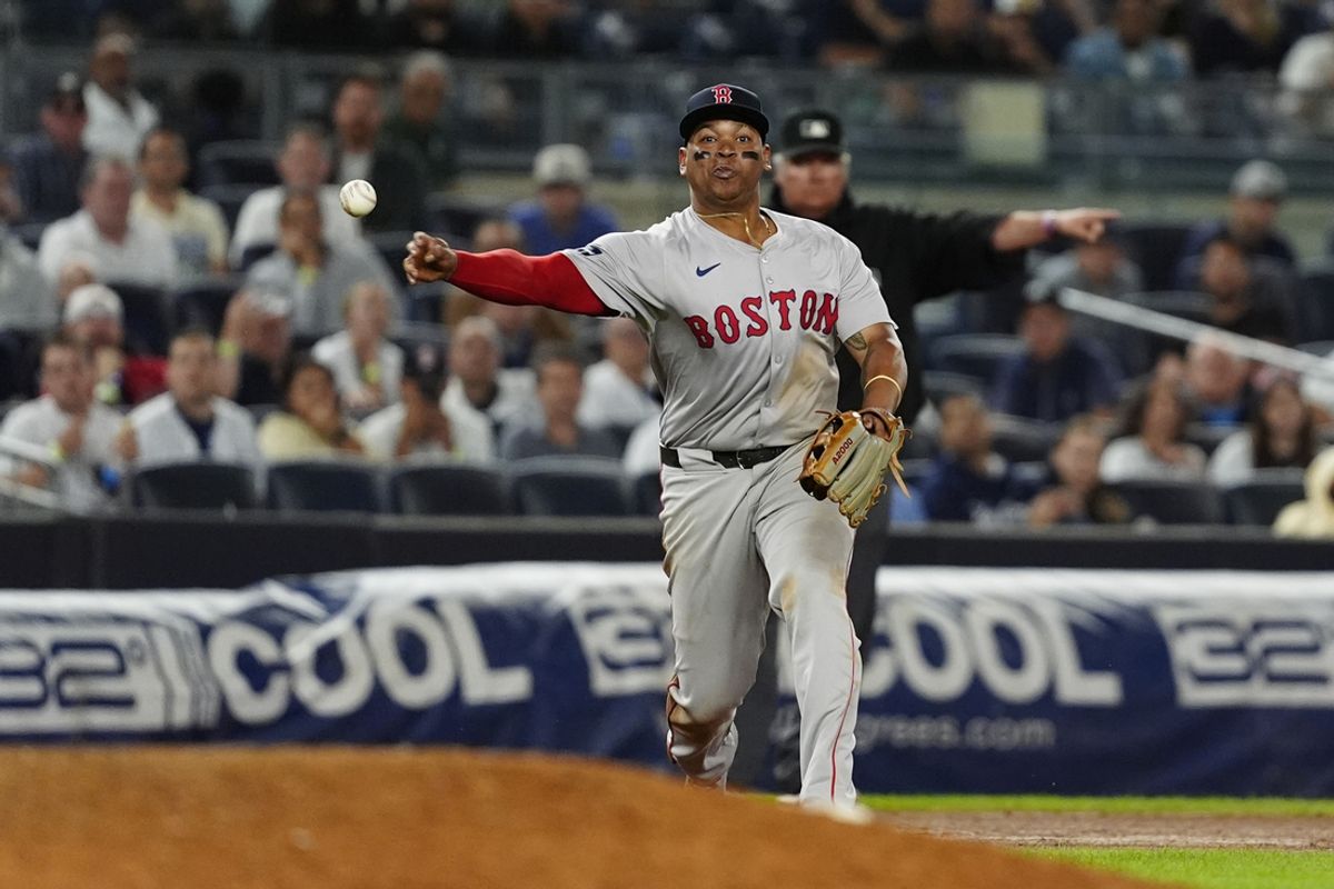 Sep 12, 2024; Bronx, New York, USA; Boston Red Sox third baseman Rafael Devers (11) throws out New York Yankees shortstop Anthony Volpe (not pictured) after fielding a ground ball during the ninth inning at Yankee Stadium. Mandatory Credit: Gregory Fisher-Imagn Images