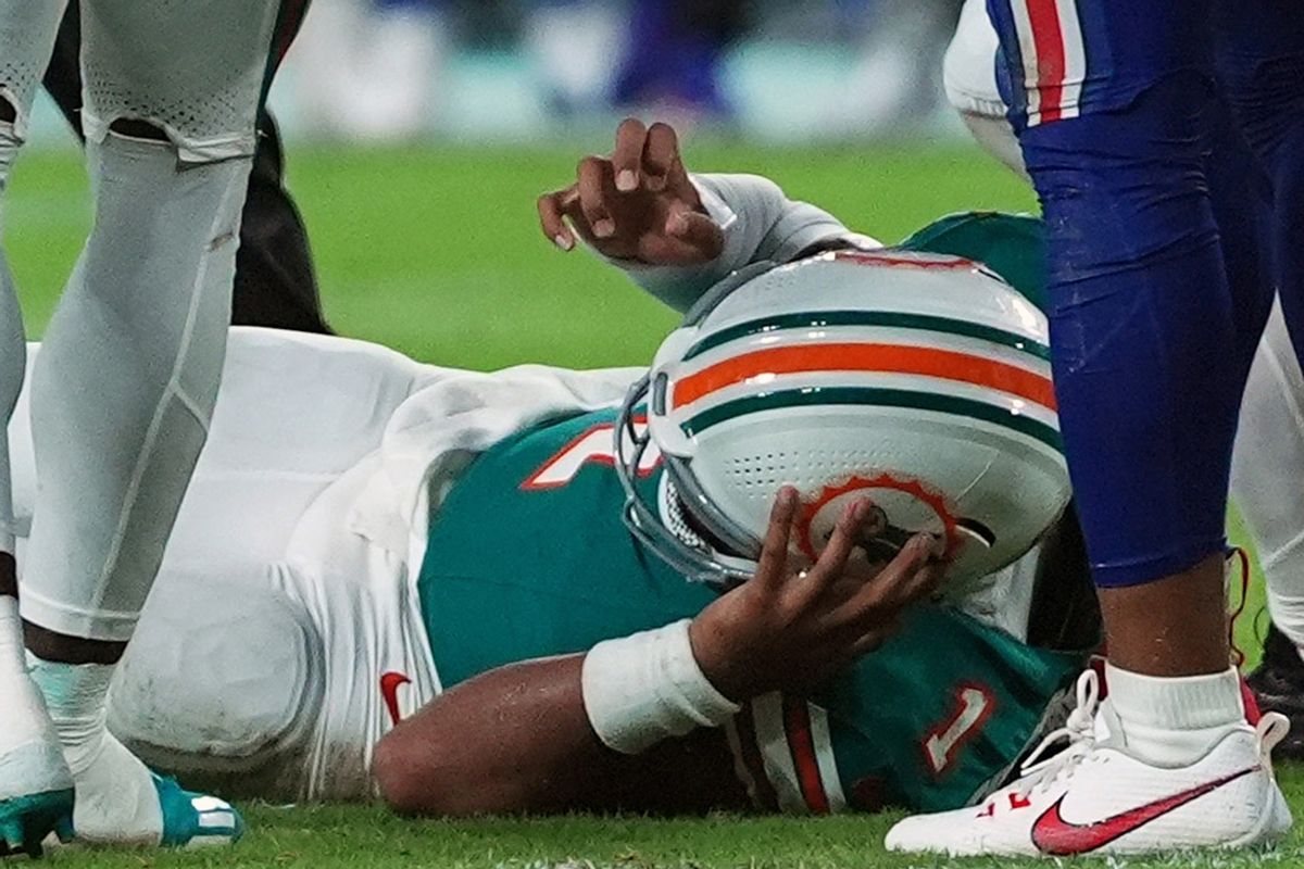 Sep 12, 2024; Miami Gardens, Florida, USA; Miami Dolphins quarterback Tua Tagovailoa (1) sufferes an apparent concussion after hitting his head on the ground while being tackled by Buffalo Bills safety Damar Hamlin (3) during the second half at Hard Rock Stadium. Mandatory Credit: Jasen Vinlove-Imagn Images