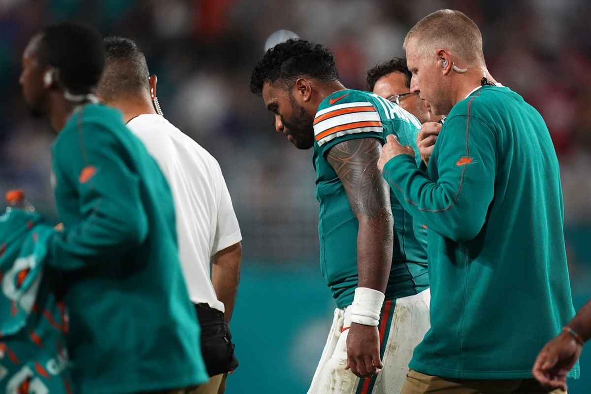 Sep 12, 2024; Miami Gardens, Florida, USA; Miami Dolphins quarterback Tua Tagovailoa (1) walks off the field with training staff after an apparent injury during the second half against the Buffalo Bills at Hard Rock Stadium. Mandatory Credit: Jasen Vinlove-Imagn Images
