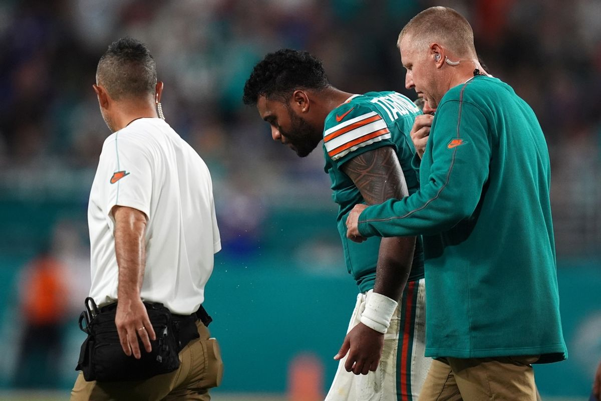 Sep 12, 2024; Miami Gardens, Florida, USA; Miami Dolphins quarterback Tua Tagovailoa (1) walks off the field with training staff after an apparent injury during the second half against the Buffalo Bills at Hard Rock Stadium. Mandatory Credit: Jasen Vinlove-Imagn Images