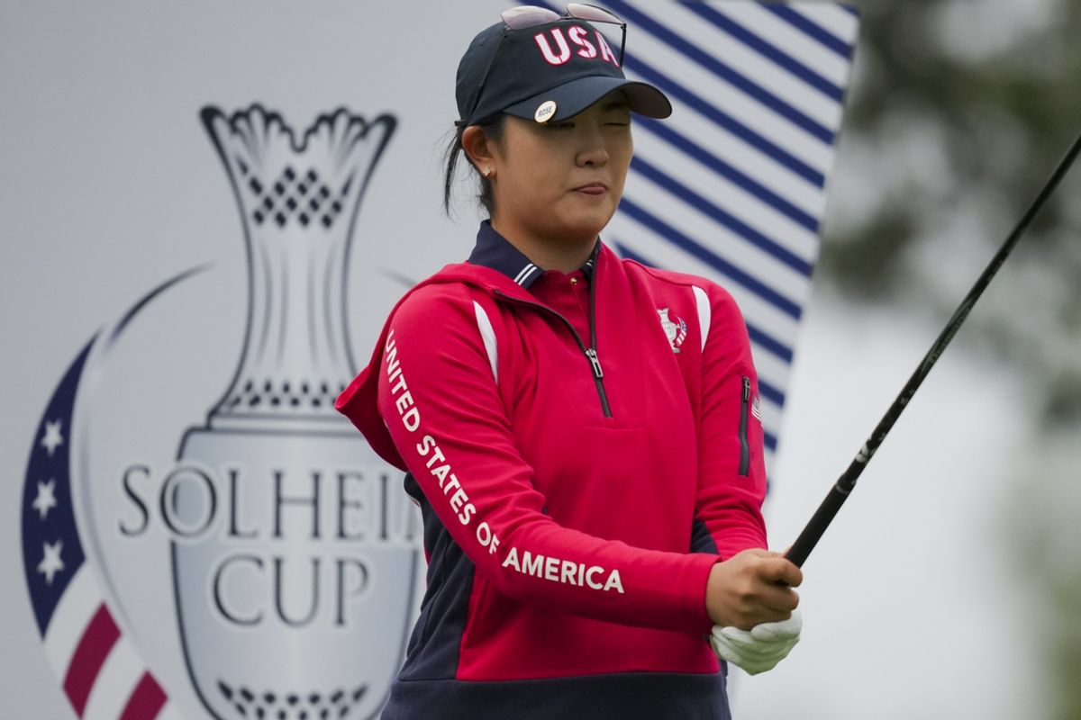 Sep 13, 2024; Gainesville, Virginia, USA; Rose Zhang of Team USA prepares to play a shot from the second tee during Foursomes matches against Team Europe during the first round of the Solheim Cup 2024 at Robert Trent Jones Golf Club. Mandatory Credit: Aaron Doster-Imagn Images