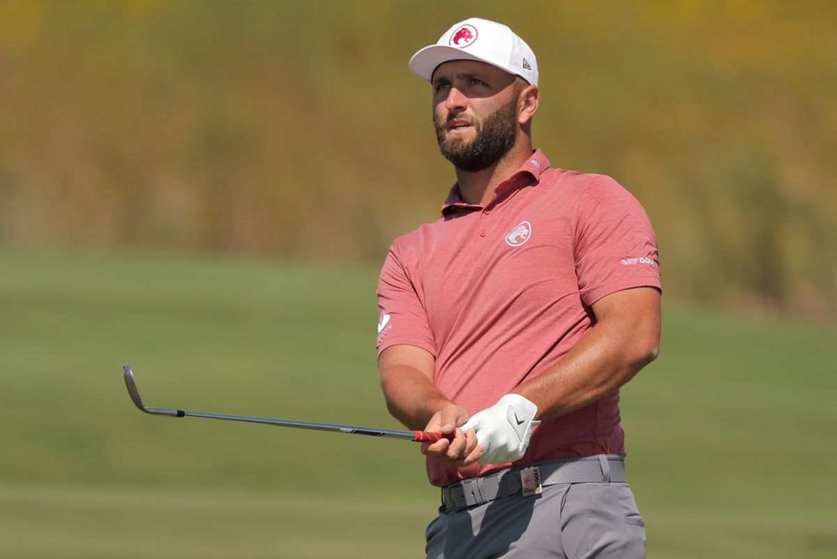 Sep 13, 2024; Bolingbrook, Illinois, USA; Jon Rahm of the Legion XIII watches his shot on the third hole of the first round of the LIV Golf Chicago tournament at Bolingbrook Golf Club. Mandatory Credit: Melissa Tamez-Imagn Images