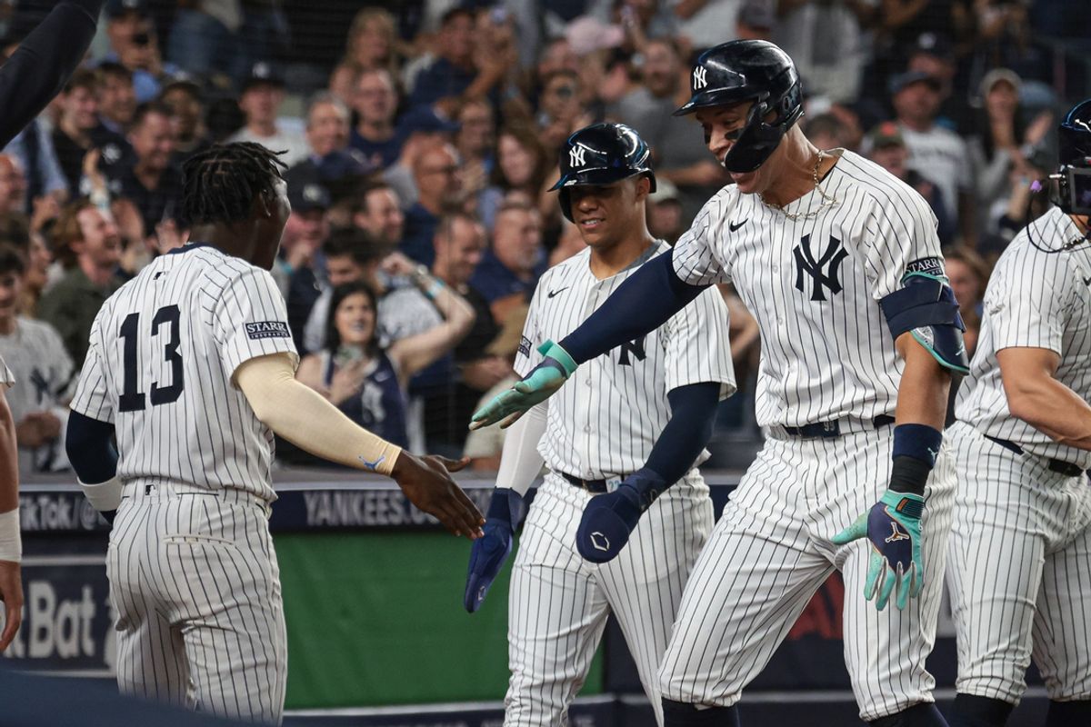 Sep 13, 2024; Bronx, New York, USA; New York Yankees center fielder Aaron Judge (99) celebrates with third baseman Jazz Chisholm Jr. (13) after hitting a grand slam home run during the seventh inning against the Boston Red Sox at Yankee Stadium. Mandatory Credit: Vincent Carchietta-Imagn Images