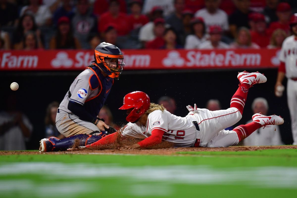 Sep 13, 2024; Anaheim, California, USA; Los Angeles Angels second baseman Jack Lopez (10) scores a run against the Houston Astros during the third inning at Angel Stadium. Mandatory Credit: Gary A. Vasquez-Imagn Images