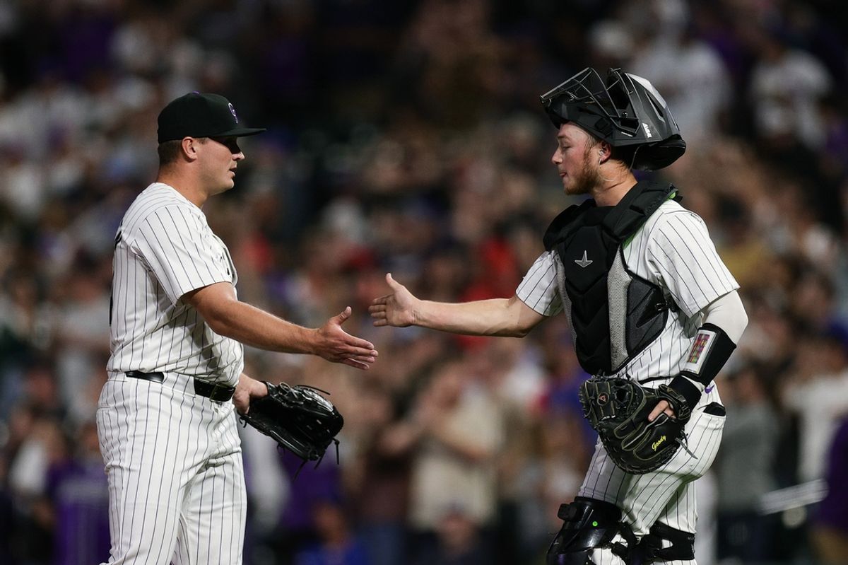 Sep 13, 2024; Denver, Colorado, USA; Colorado Rockies relief pitcher Seth Halvorsen (54) celebrates with catcher Hunter Goodman (15) after the game against the Chicago Cubs at Coors Field. Mandatory Credit: Isaiah J. Downing-Imagn Images