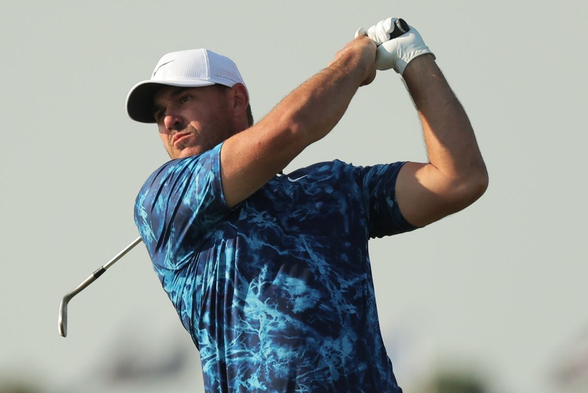 Brooks Koepka of Smash GC watches his shot on the second hole of the first round of the LIV Golf Chicago tournament at Bolingbrook Golf Club.