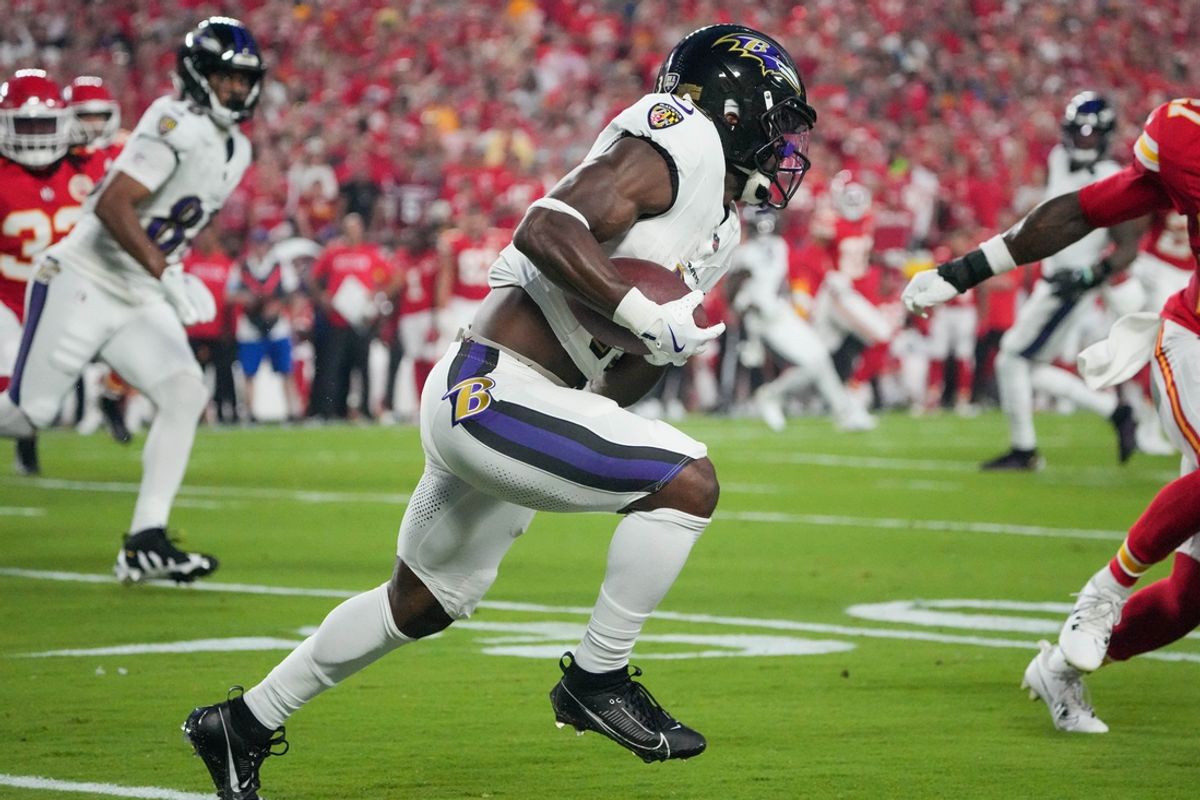 Sep 5, 2024; Kansas City, Missouri, USA; Baltimore Ravens running back Justice Hill (43) runs the ball against the Kansas City Chiefs during the game at GEHA Field at Arrowhead Stadium. Mandatory Credit: Denny Medley-Imagn Images