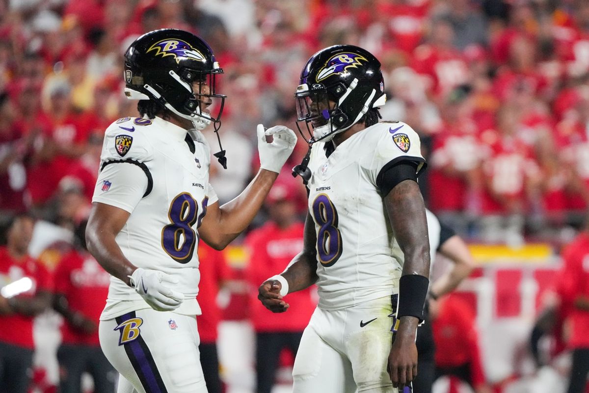 Sep 5, 2024; Kansas City, Missouri, USA; Baltimore Ravens tight end Isaiah Likely (80) talks with quarterback Lamar Jackson (8) after a play against the Kansas City Chiefs during the game at GEHA Field at Arrowhead Stadium. Mandatory Credit: Denny Medley-Imagn Images