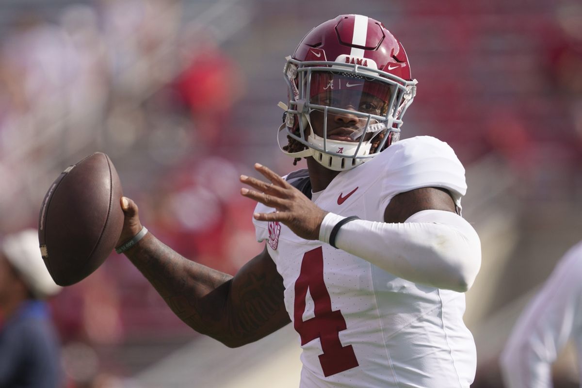 Sep 14, 2024; Madison, Wisconsin, USA;  Alabama Crimson Tide quarterback Jalen Milroe (4) throws a pass during warmups prior to the game against the Wisconsin Badgers at Camp Randall Stadium. Mandatory Credit: Jeff Hanisch-Imagn Images