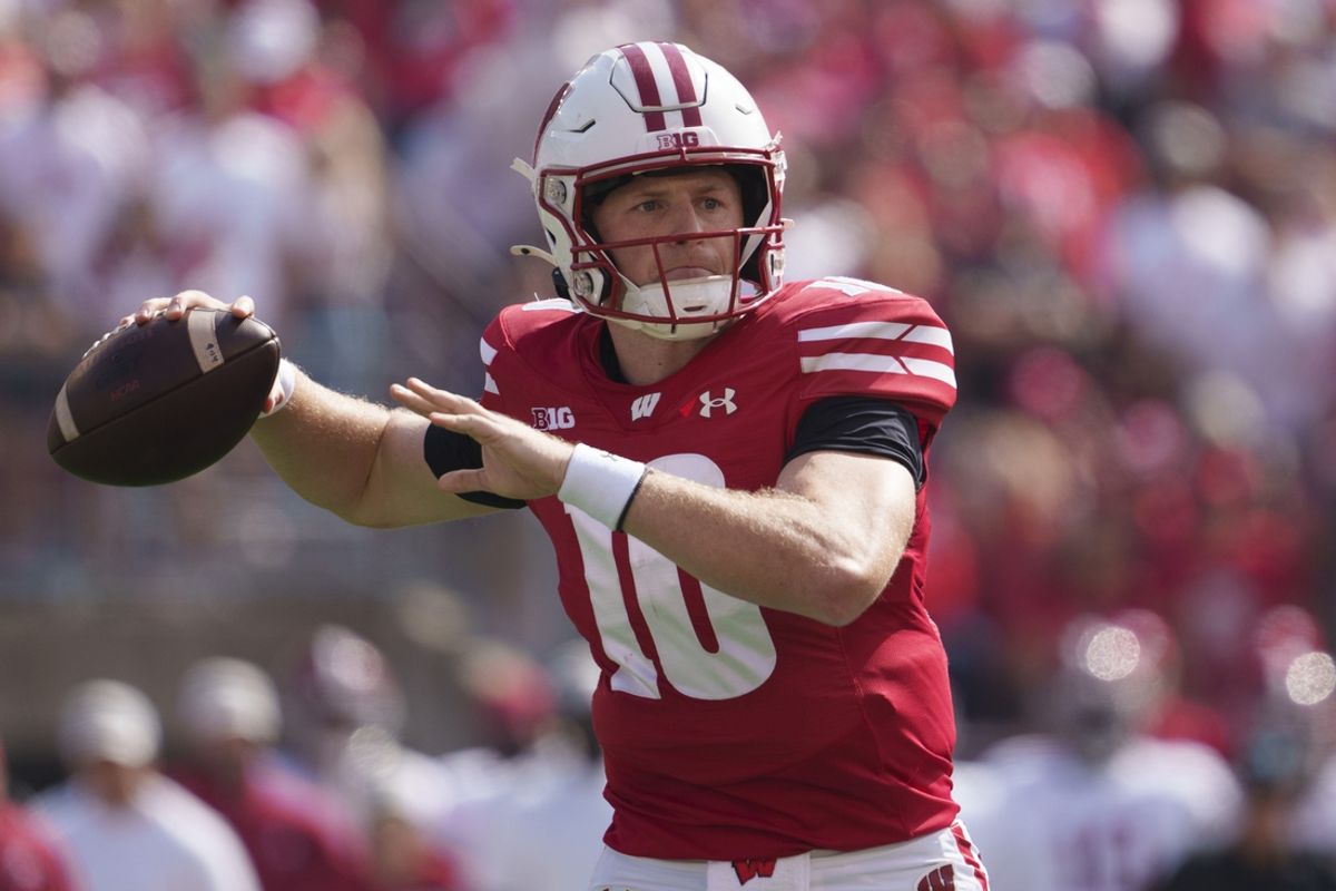 Sep 14, 2024; Madison, Wisconsin, USA;  Wisconsin Badgers quarterback Tyler Van Dyke (10) throws a pass during the first quarter against the Alabama Crimson Tide at Camp Randall Stadium. Mandatory Credit: Jeff Hanisch-Imagn Images