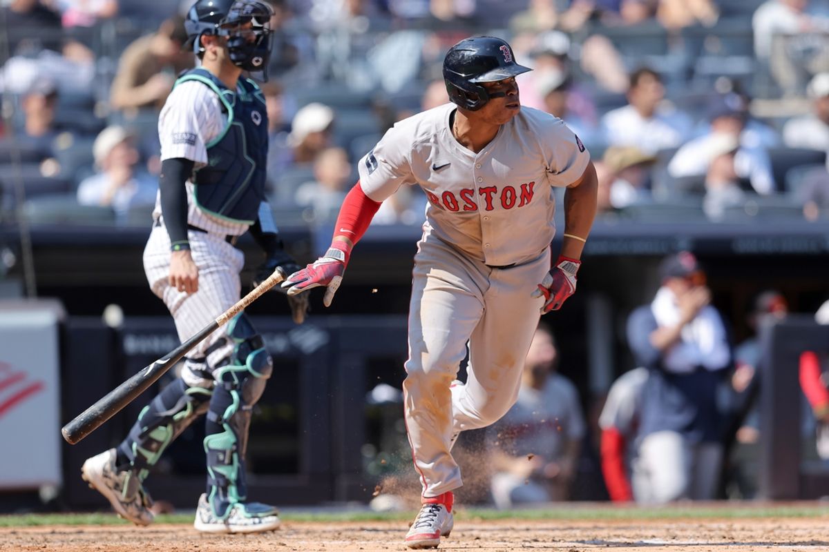 Sep 14, 2024; Bronx, New York, USA; Boston Red Sox third baseman Rafael Devers (11) follows through on a two run single against the New York Yankees during the fifth inning at Yankee Stadium. Mandatory Credit: Brad Penner-Imagn Images