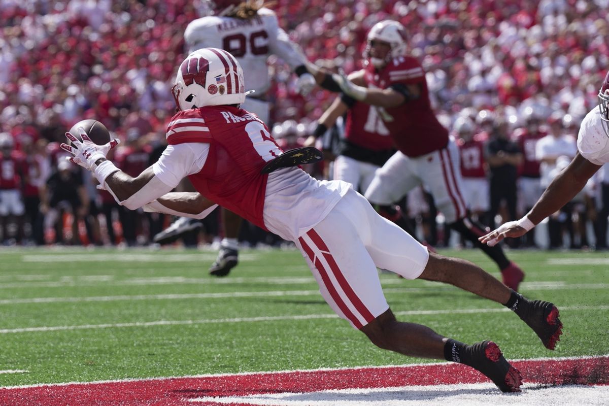 Sep 14, 2024; Madison, Wisconsin, USA;  Wisconsin Badgers wide receiver Will Pauling (6) catches a pass to score a touchdown during the third quarter against the Alabama Crimson Tide at Camp Randall Stadium. Mandatory Credit: Jeff Hanisch-Imagn Images