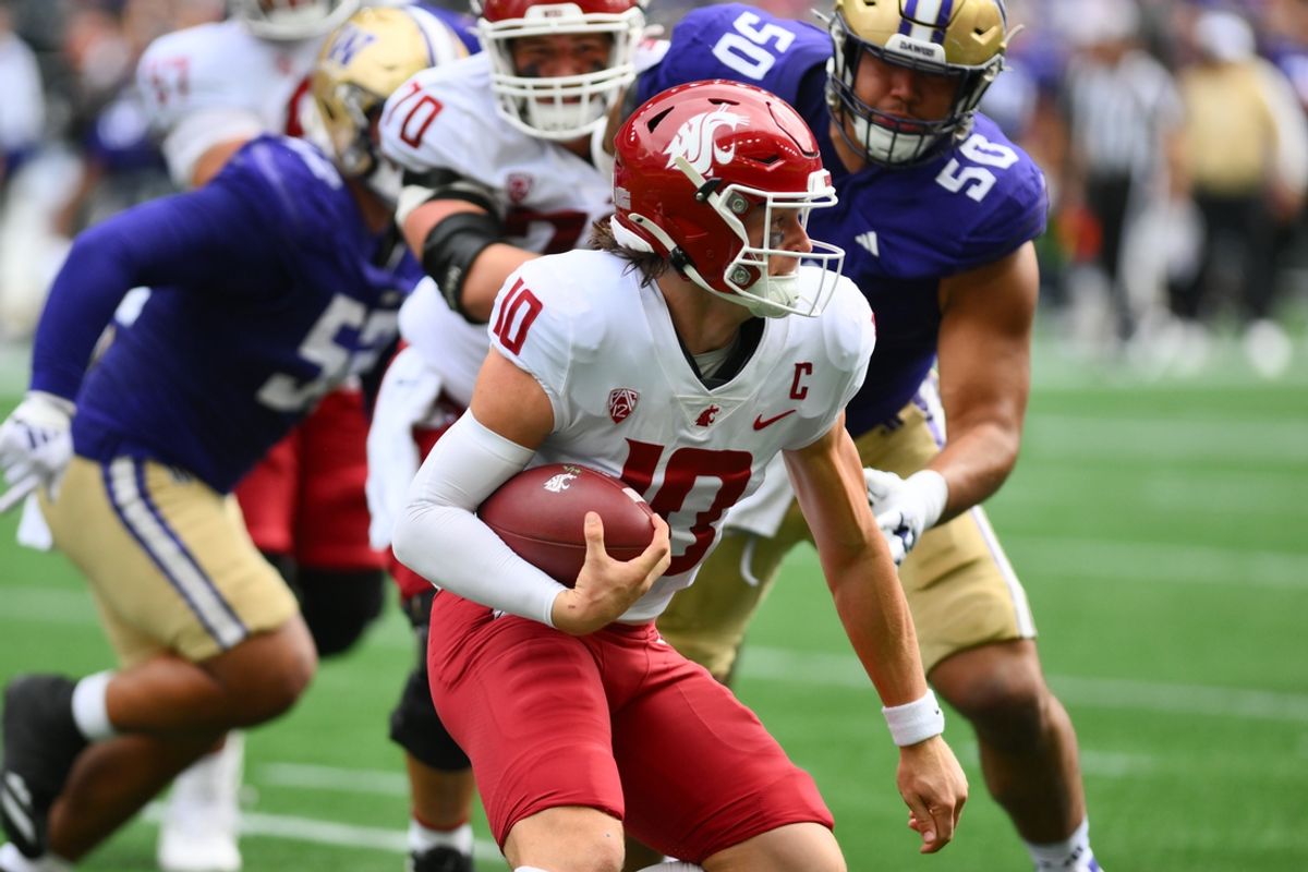 Sep 14, 2024; Seattle, Washington, USA; Washington State Cougars quarterback John Mateer (10) carries the ball against the Washington Huskies during the first half at Lumen Field. Mandatory Credit: Steven Bisig-Imagn Images