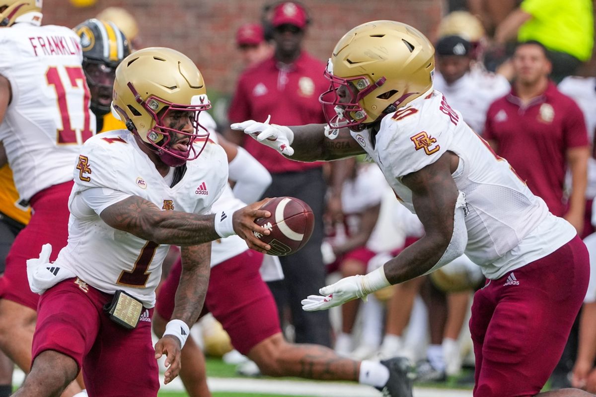 Sep 14, 2024; Columbia, Missouri, USA; Boston College Eagles quarterback Thomas Castellanos (1) hands off to running back Kye Robichaux (5) against the Missouri Tigers during the second half at Faurot Field at Memorial Stadium. Mandatory Credit: Denny Medley-Imagn Images