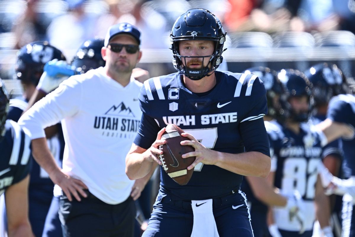 Sep 14, 2024; Logan, Utah, USA;  Utah State Aggies quarterback Spencer Petras (7) warms up before a game against the Utah Utes at Merlin Olsen Field at Maverik Stadium. Mandatory Credit: Jamie Sabau-Imagn Images