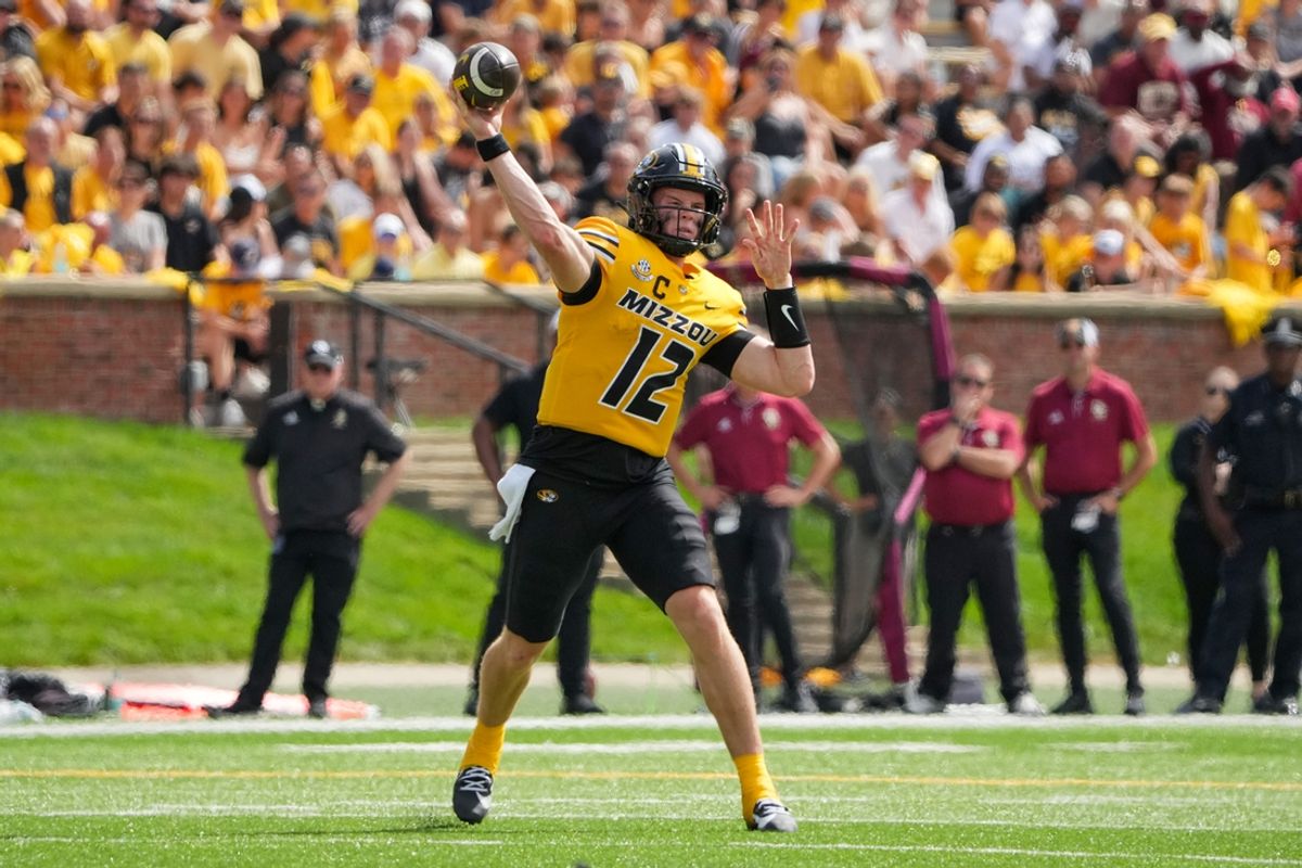 Sep 14, 2024; Columbia, Missouri, USA; Missouri Tigers quarterback Brady Cook (12) throws a pass against the Boston College Eagles during the second half at Faurot Field at Memorial Stadium. Mandatory Credit: Denny Medley-Imagn Images