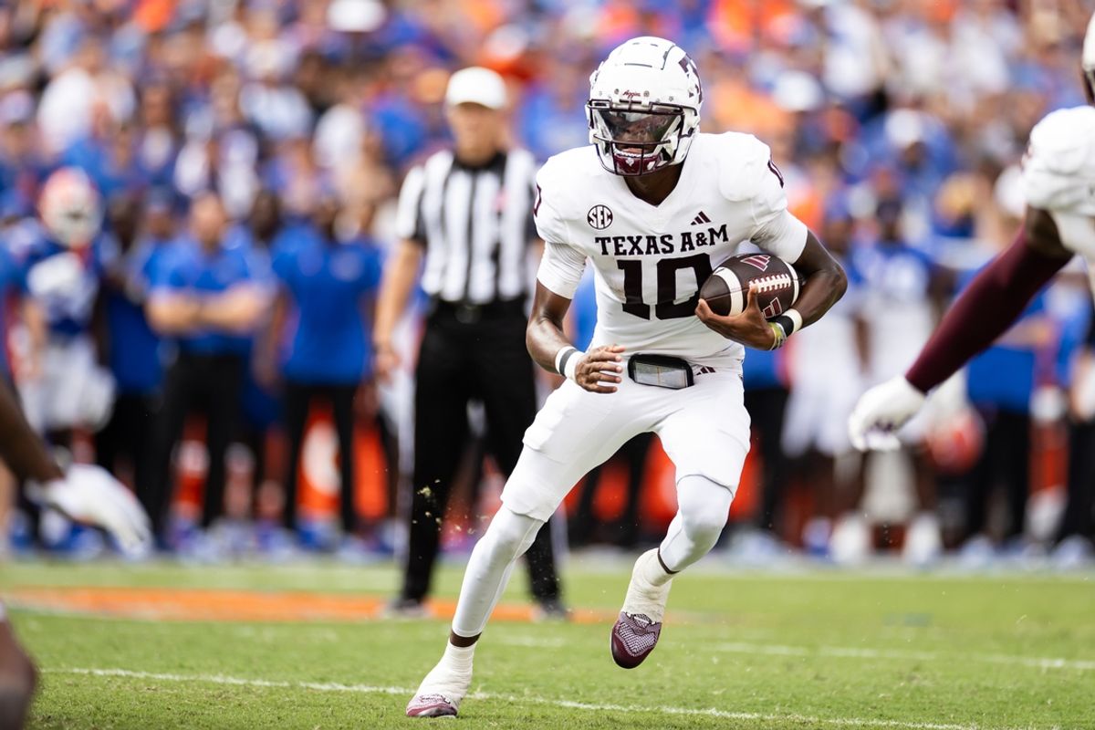 Sep 14, 2024; Gainesville, Florida, USA; Texas A&M Aggies quarterback Marcel Reed (10) runs with the ball against the Florida Gators during the first half at Ben Hill Griffin Stadium. Mandatory Credit: Matt Pendleton-Imagn Images
