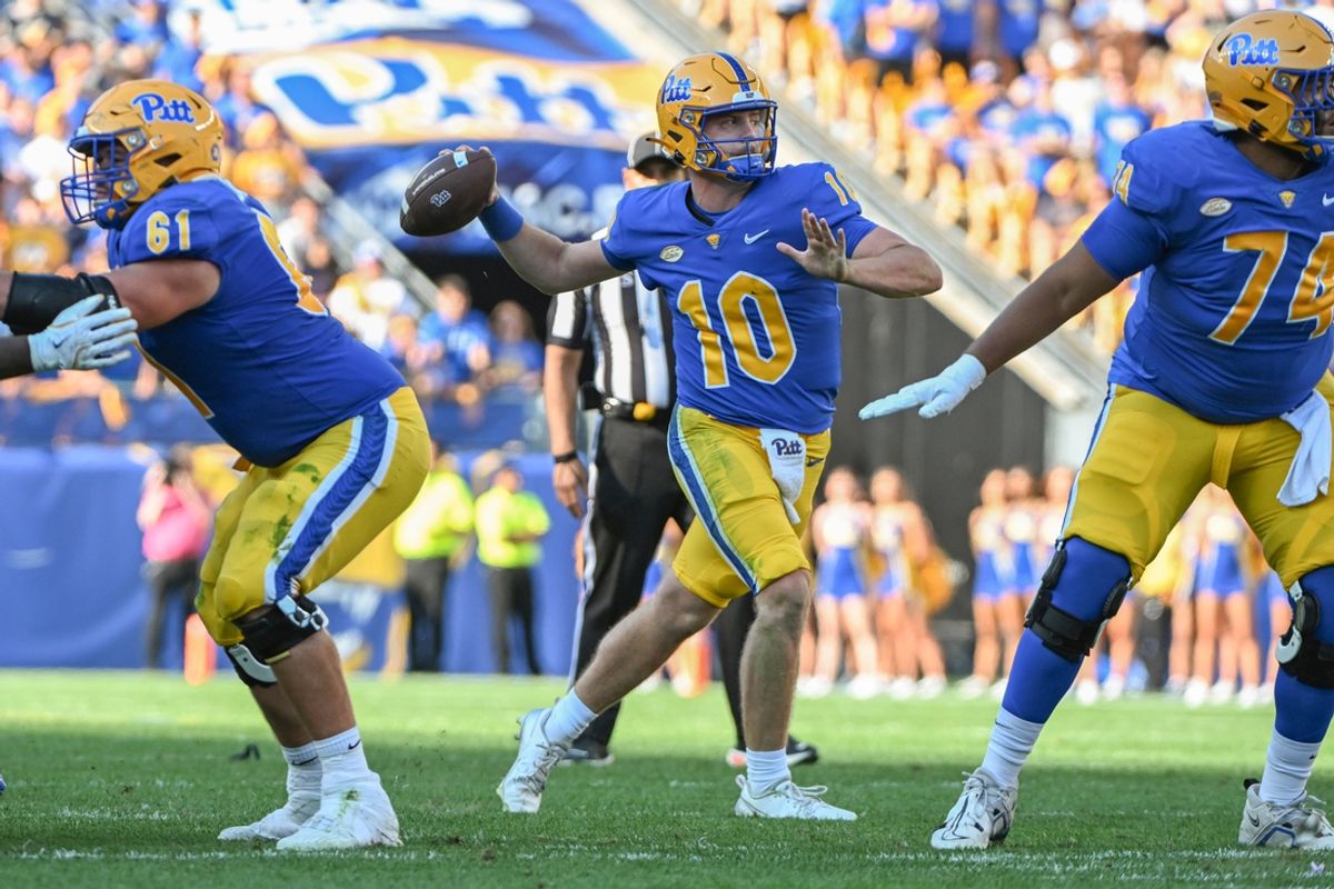 Sep 14, 2024; Pittsburgh, Pennsylvania, USA; Pittsburgh Panthers quarterback Eli Holstein (10) throws a touchdown pass against the West Virginia Mountaineers during the second quarter at Acrisure Stadium. Mandatory Credit: Barry Reeger-Imagn Images