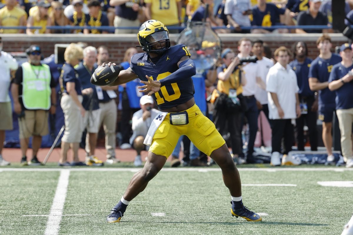 Sep 14, 2024; Ann Arbor, Michigan, USA;  Michigan Wolverines quarterback Alex Orji (10) throws against the Arkansas State Red Wolves during the second half at Michigan Stadium. Mandatory Credit: Rick Osentoski-Imagn Images