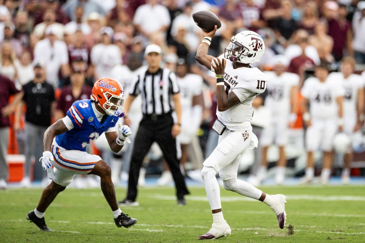 Sep 14, 2024; Gainesville, Florida, USA; Texas A&M Aggies quarterback Marcel Reed (10) throws the ball under pressure from Florida Gators defensive back Jason Marshall Jr. (3) during the first half at Ben Hill Griffin Stadium. Mandatory Credit: Matt Pendleton-Imagn Images