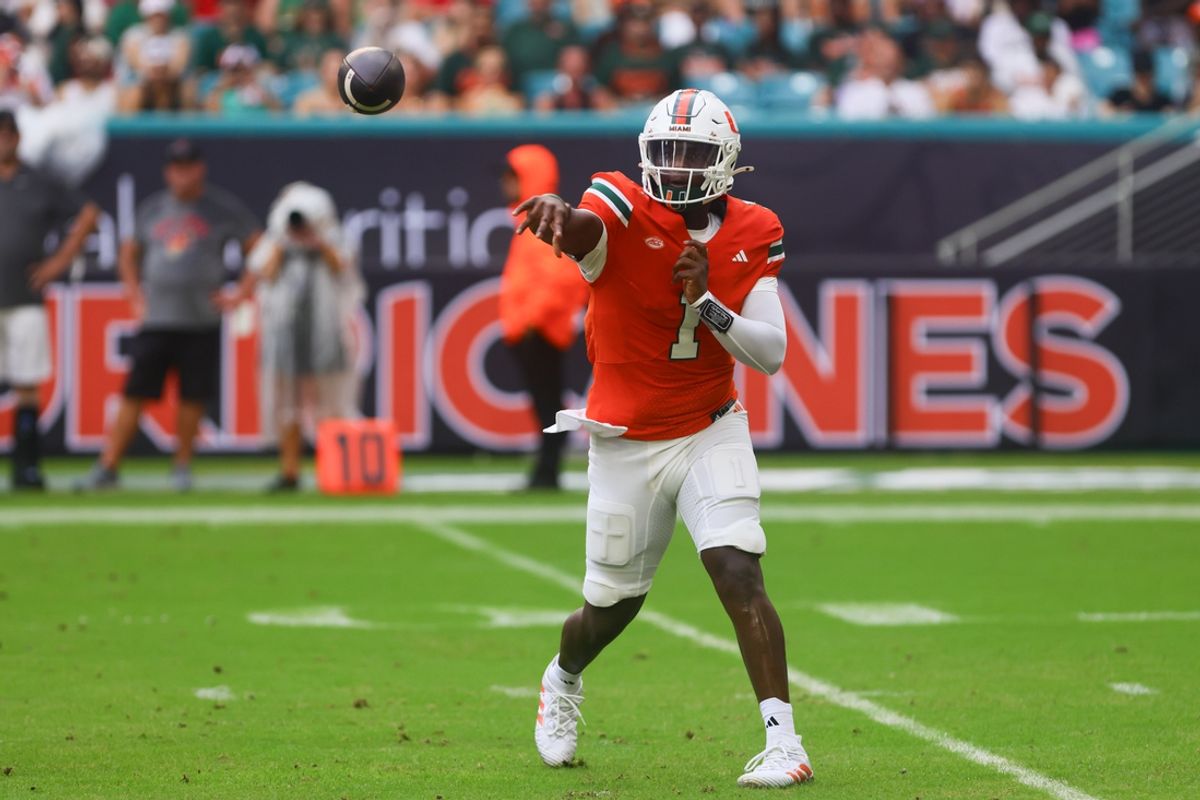 Sep 14, 2024; Miami Gardens, Florida, USA;  Miami Hurricanes quarterback Cam Ward (1) passes the football against the Ball State Cardinals during the first quarter at Hard Rock Stadium. Mandatory Credit: Sam Navarro-Imagn Images