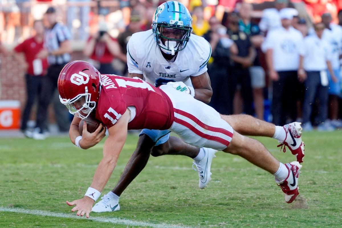 Oklahoma Sooners quarterback Jackson Arnold (11) dives for a touchdown beside Tulane Green Wave defensive back Johnathan Edwards (8) during a college football game between the University of Oklahoma Sooners (OU) and the Tulane Green Wave at Gaylord Family - Oklahoma Memorial Stadium in Norman, Okla., Saturday, Sept. 14, 2024.