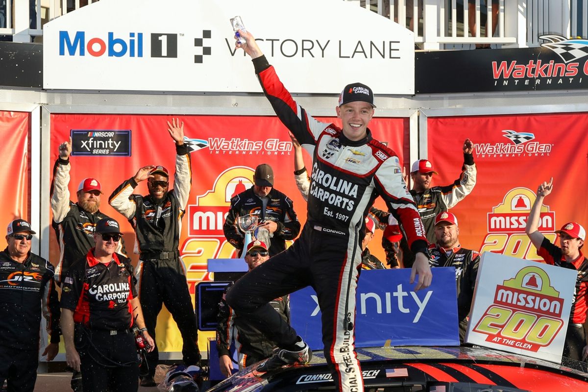 Sep 14, 2024; Watkins Glen, New York, USA; NASCAR Xfinity Series driver Connor Zilisch celebrates in victory lane after winning the Mission 200 at The Glen at Watkins Glen International. Mandatory Credit: Matthew O'Haren-Imagn Images