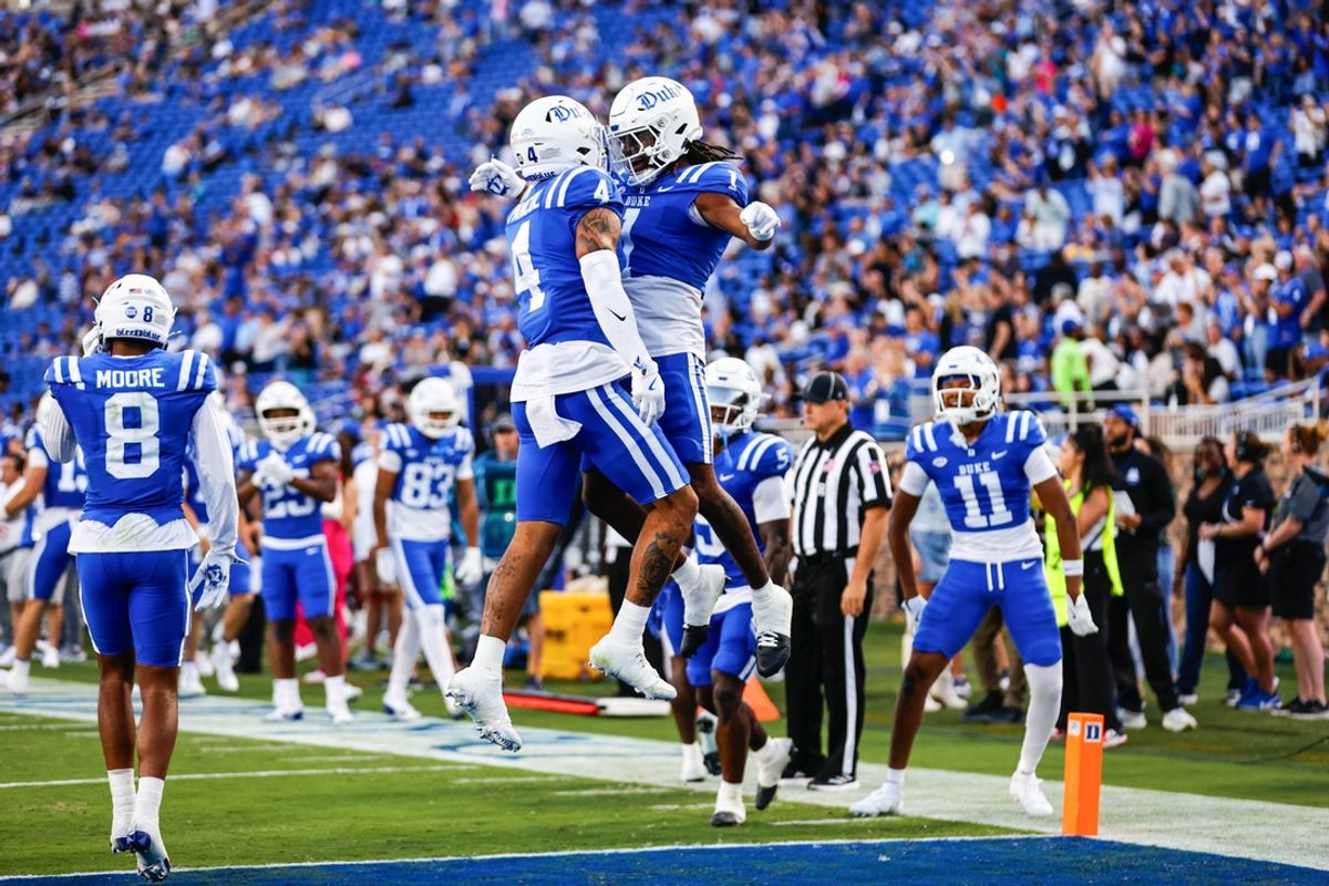 Sep 14, 2024; Durham, North Carolina, USA; Duke Blue Devils wide receiver Eli Pancol (4) and wide receiver Jontavis Robertson (1) celebrate a touchdown during the first half of the game against Connecticut at Wallace Wade Stadium. Mandatory Credit: Jaylynn Nash-Imagn Images