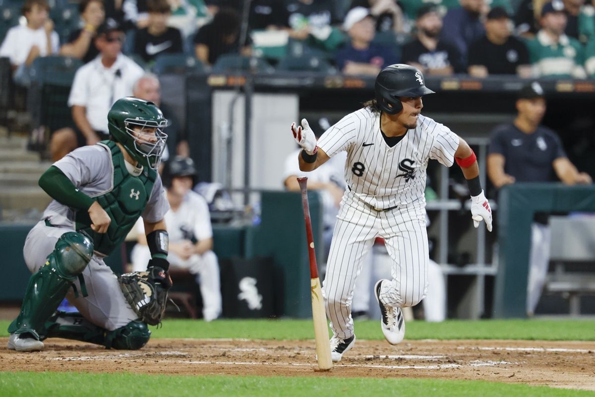 Sep 14, 2024; Chicago, Illinois, USA; Chicago White Sox second baseman Nicky Lopez (8) hits a two-run single against the Oakland Athletics during the second inning at Guaranteed Rate Field. Mandatory Credit: Kamil Krzaczynski-Imagn Images