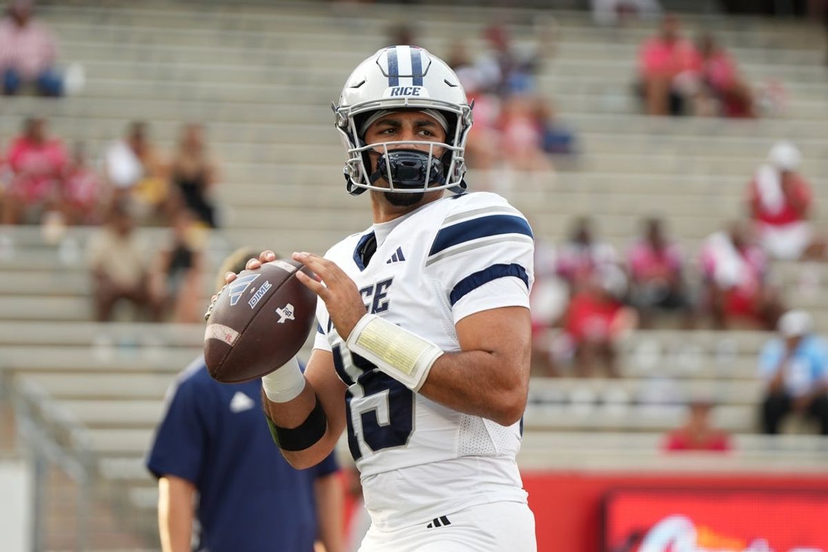 Sep 14, 2024; Houston, Texas, USA; Rice Owls quarterback Shawqi Itraish (15) warms up pregame at TDECU Stadium. Mandatory Credit: Sean Thomas-Imagn Images