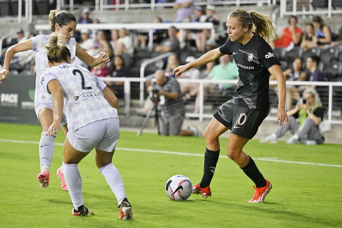 Sep 14, 2024; Louisville, Kentucky, USA; Angel City FC forward Claire Emslie (10) controls the ball against Racing Louisville FC during the first half at Lynn Family Stadium. Mandatory Credit: Jamie Rhodes-Imagn Images