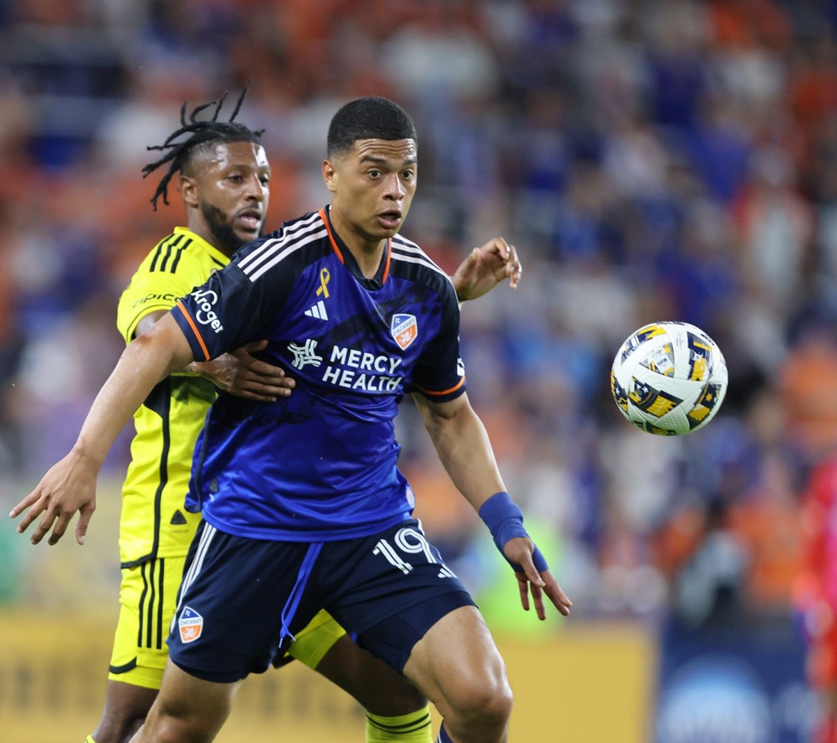 Sep 14, 2024; Cincinnati, Ohio, USA; FC Cincinnati's Kevin Kelsy (19) controls a ball during the first half against the Columbus Crew at TQL Stadium. Mandatory Credit: Joseph Maiorana-Imagn Images