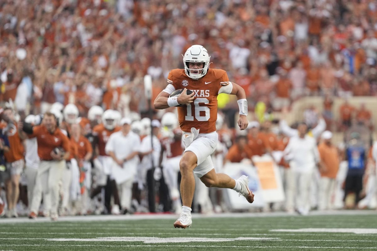 Sep 14, 2024; Austin, Texas, USA; Texas Longhorns quarterback Arch Manning (16) runs for a touchdown during the first half against the Texas-San Antonio Roadrunners at Darrell K Royal-Texas Memorial Stadium. Mandatory Credit: Scott Wachter-Imagn Images