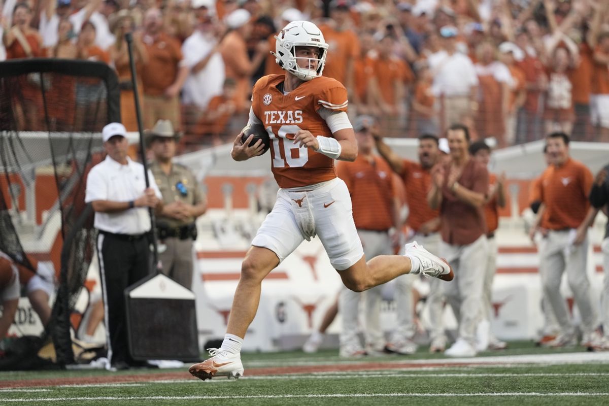 Sep 14, 2024; Austin, Texas, USA; Texas Longhorns quarterback Arch Manning (16) runs for a touchdown during the first half against the Texas-San Antonio Roadrunners at Darrell K Royal-Texas Memorial Stadium. Mandatory Credit: Scott Wachter-Imagn Images
