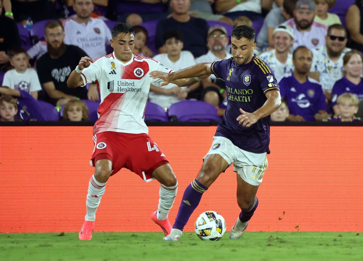 Sep 14, 2024; Orlando, Florida, USA; Orlando City midfielder Martin Ojeda (11) and New England Revolution forward Luca Langoni (41) fight to control the ball during the first half at Inter&Co Stadium. Mandatory Credit: Kim Klement Neitzel-Imagn Images