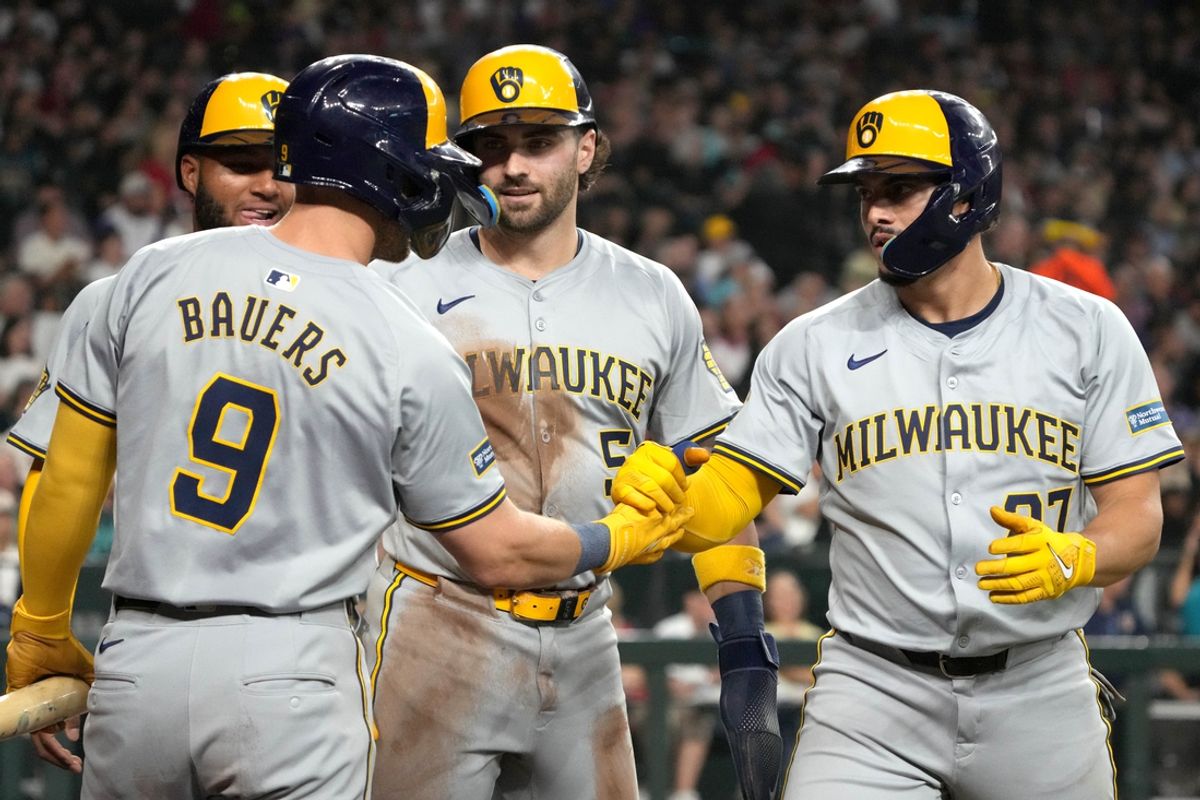 Sep 14, 2024; Phoenix, Arizona, USA; Milwaukee Brewers shortstop Willy Adames (27) celebrates with teammates after hitting a grand slam against the Arizona Diamondbacks in the second inning at Chase Field. Mandatory Credit: Rick Scuteri-Imagn Images