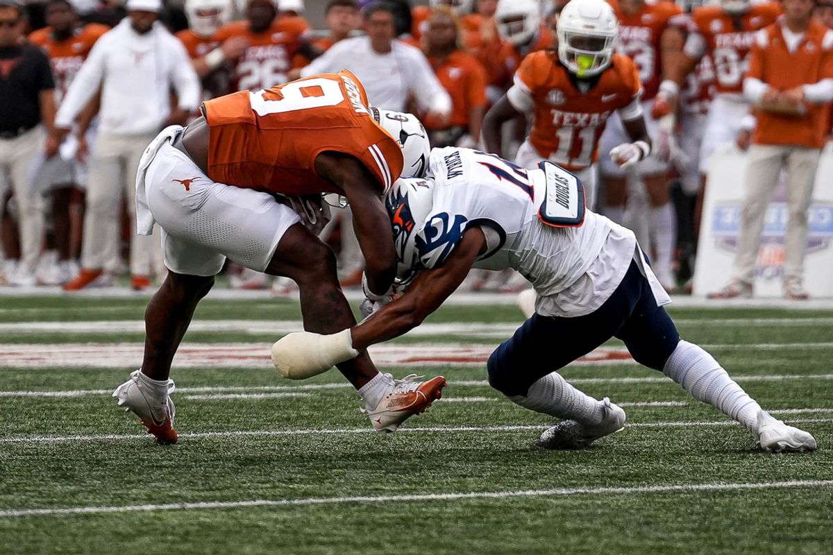 Texas Longhorns running back Jerick Gibson (9) runs into UTSA safety Jimmy Wyrick (18) during the game at Darrell K Royal-Texas Memorial Stadium in Austin Saturday, Sept. 14, 2024.