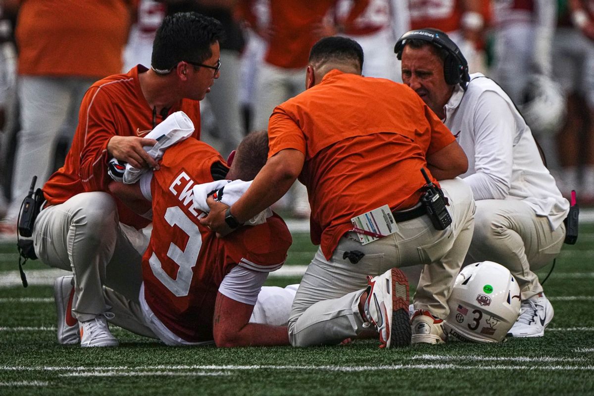 Trainers tend to Texas Longhorns quarterback Quinn Ewers (3) during the game against UTSA at Darrell K Royal-Texas Memorial Stadium in Austin Saturday, Sept. 14, 2024.