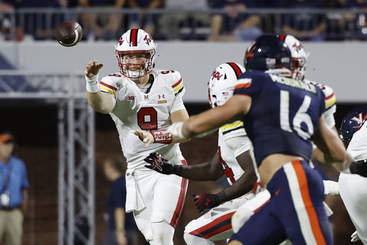 Sep 14, 2024; Charlottesville, Virginia, USA; Maryland Terrapins quarterback Billy Edwards Jr. (9) passes the ball to Terrapins running back Roman Hemby (24) as Virginia Cavaliers linebacker Trey McDonald (16) during the first half at Scott Stadium. Mandatory Credit: Geoff Burke-Imagn Images