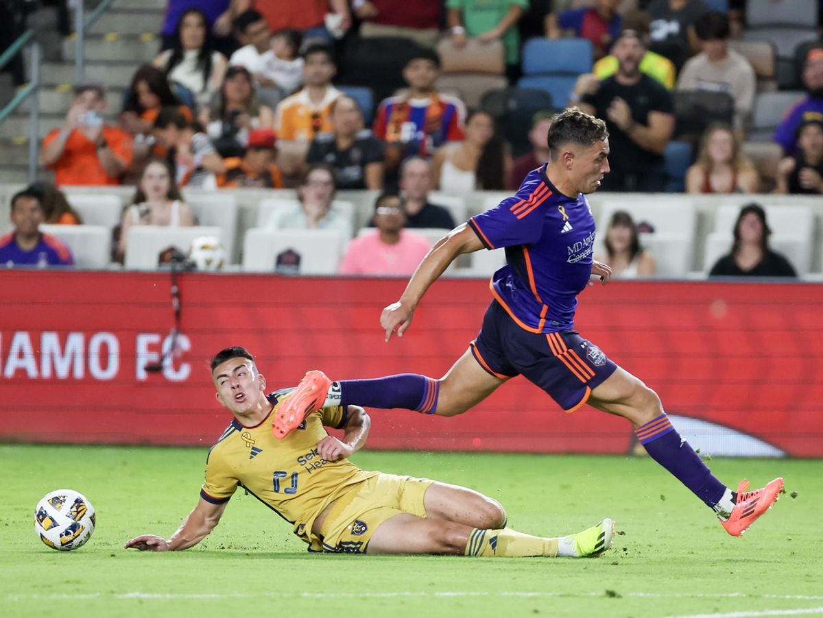 Sep 14, 2024; Houston, Texas, USA; Real Salt Lake forward Lachlan Brook (17) slide tackles Houston Dynamo FC forward Ezequiel Ponce (10) in the first half at Shell Energy Stadium. Mandatory Credit: Thomas Shea-Imagn Images