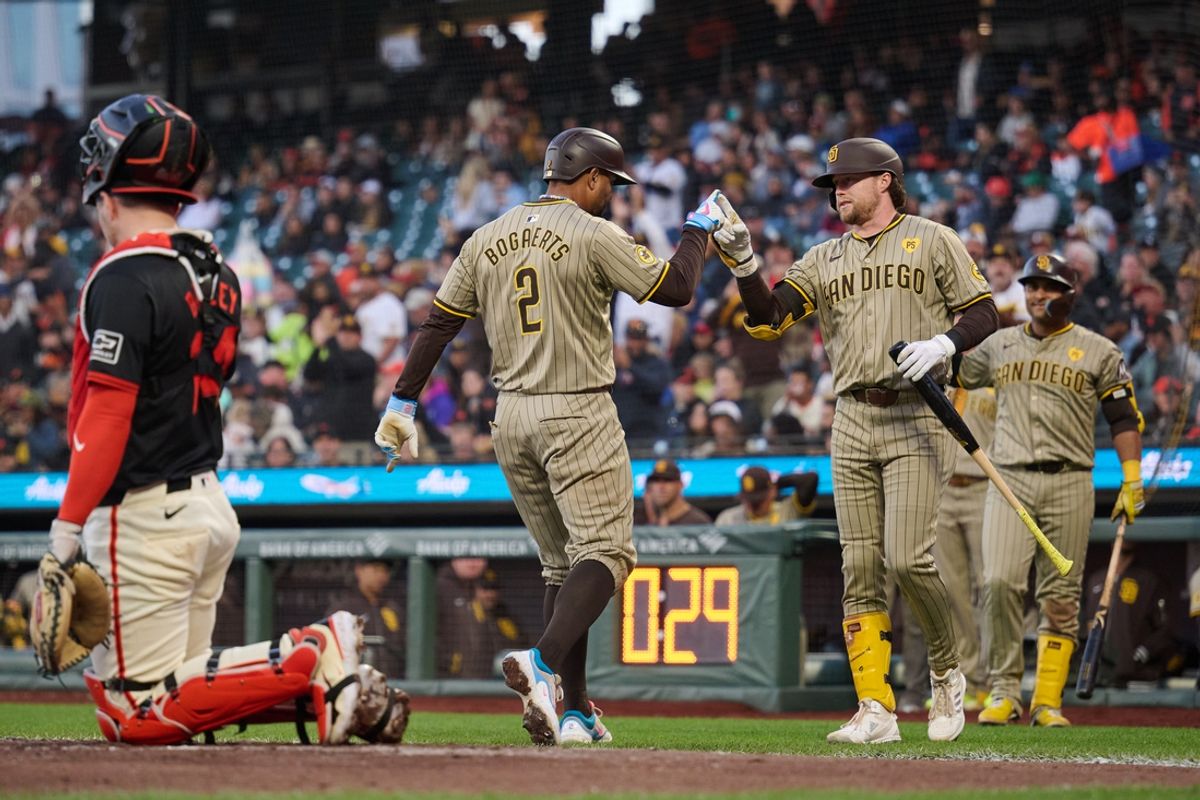 Sep 14, 2024; San Francisco, California, USA; San Diego Padres infielder Xander Bogaerts (2) celebrates with infielder Jake Cronenworth (9) after hitting a one-run home run against the San Francisco Giants during the fourth inning at Oracle Park. Mandatory Credit: Robert Edwards-Imagn Images