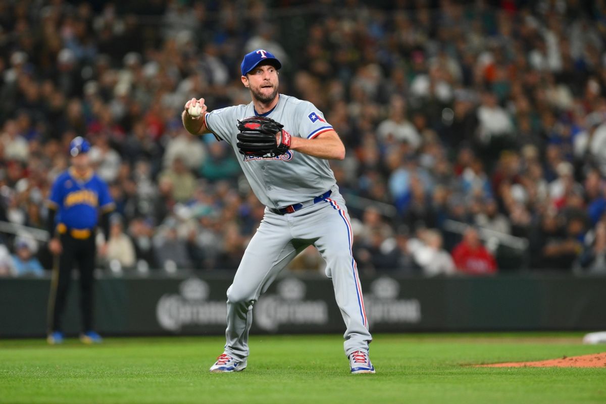 Sep 14, 2024; Seattle, Washington, USA; Texas Rangers starting pitcher Max Scherzer (31) throws the ball to first base for a force out against the Seattle Mariners during the second inning at T-Mobile Park. Mandatory Credit: Steven Bisig-Imagn Images
