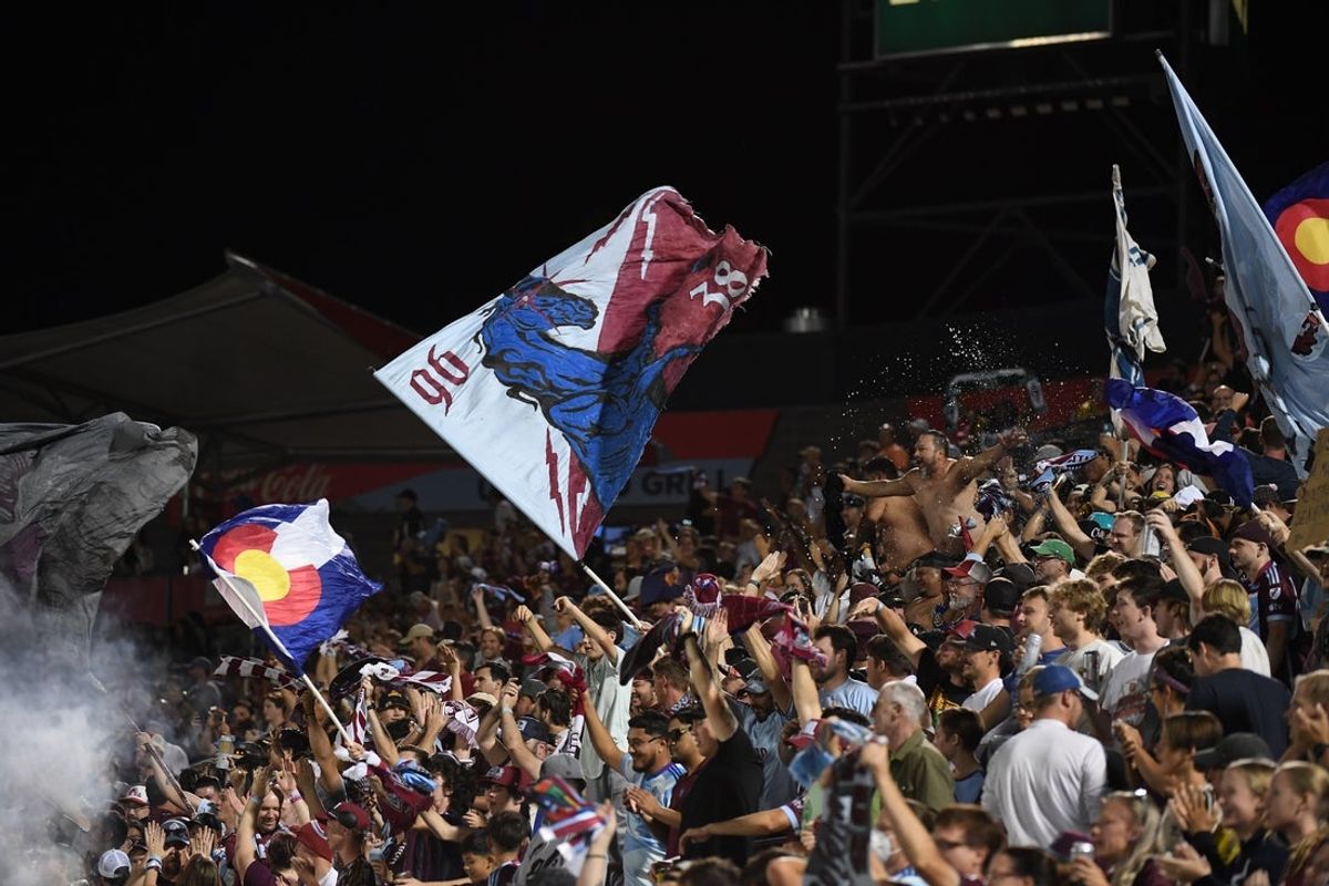 Sep 14, 2024; Commerce City, Colorado, USA; Colorado Rapids fans wave flags during the first half against the Portland Timbers  at Dick's Sporting Goods Park. Mandatory Credit: Christopher Hanewinckel-Imagn Images