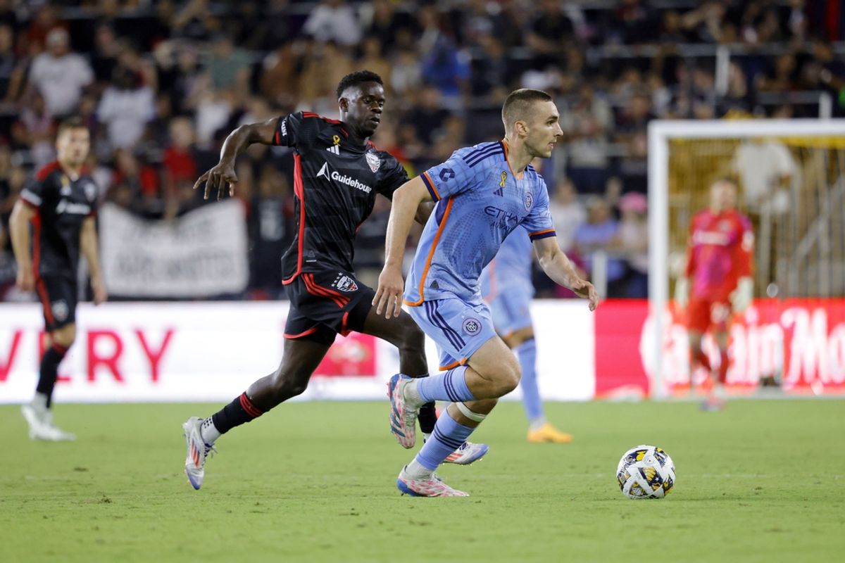 Sep 14, 2024; Washington, District of Columbia, USA; New York City FC midfielder James Sands (6) dribbles the ball against D.C. United forward Dominique Badji (23) during the second half at Audi Field. Mandatory Credit: Amber Searls-Imagn Images