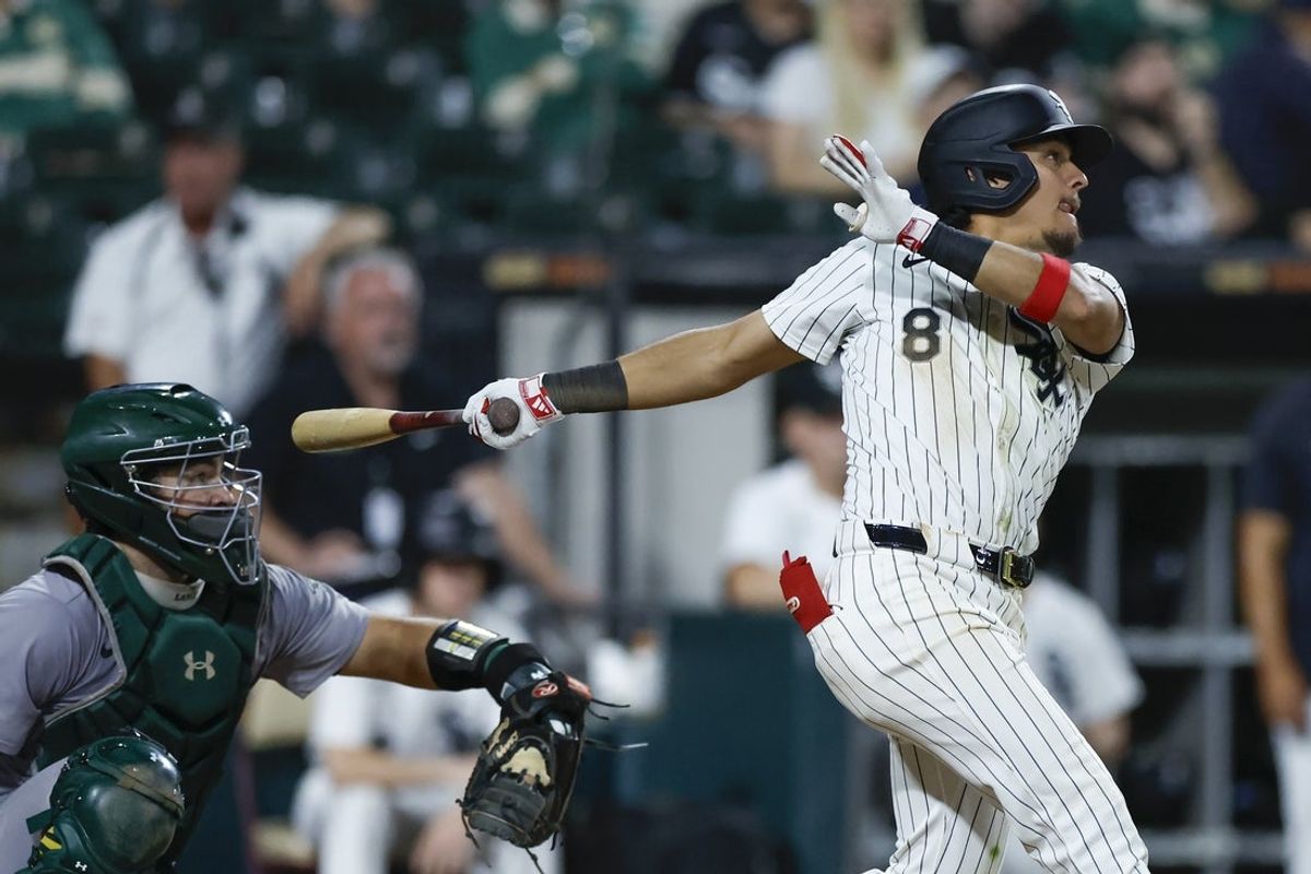 Sep 14, 2024; Chicago, Illinois, USA; Chicago White Sox second baseman Nicky Lopez (8) hits an RBI-single against the Oakland Athletics during the eight inning at Guaranteed Rate Field. Mandatory Credit: Kamil Krzaczynski-Imagn Images