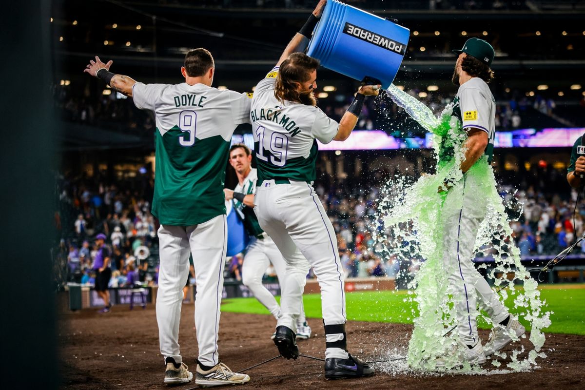 Sep 14, 2024; Denver, Colorado, USA; Colorado Rockies outfielder Brenton Doyle (9) and Colorado Rockies outfielder Charlie Blackmon (19) dump Powerade onto Colorado Rockies outfielder Sam Hilliard (16) after their win against the Chicago Cubs at Coors Field. Mandatory Credit: Chet Strange-Imagn Images