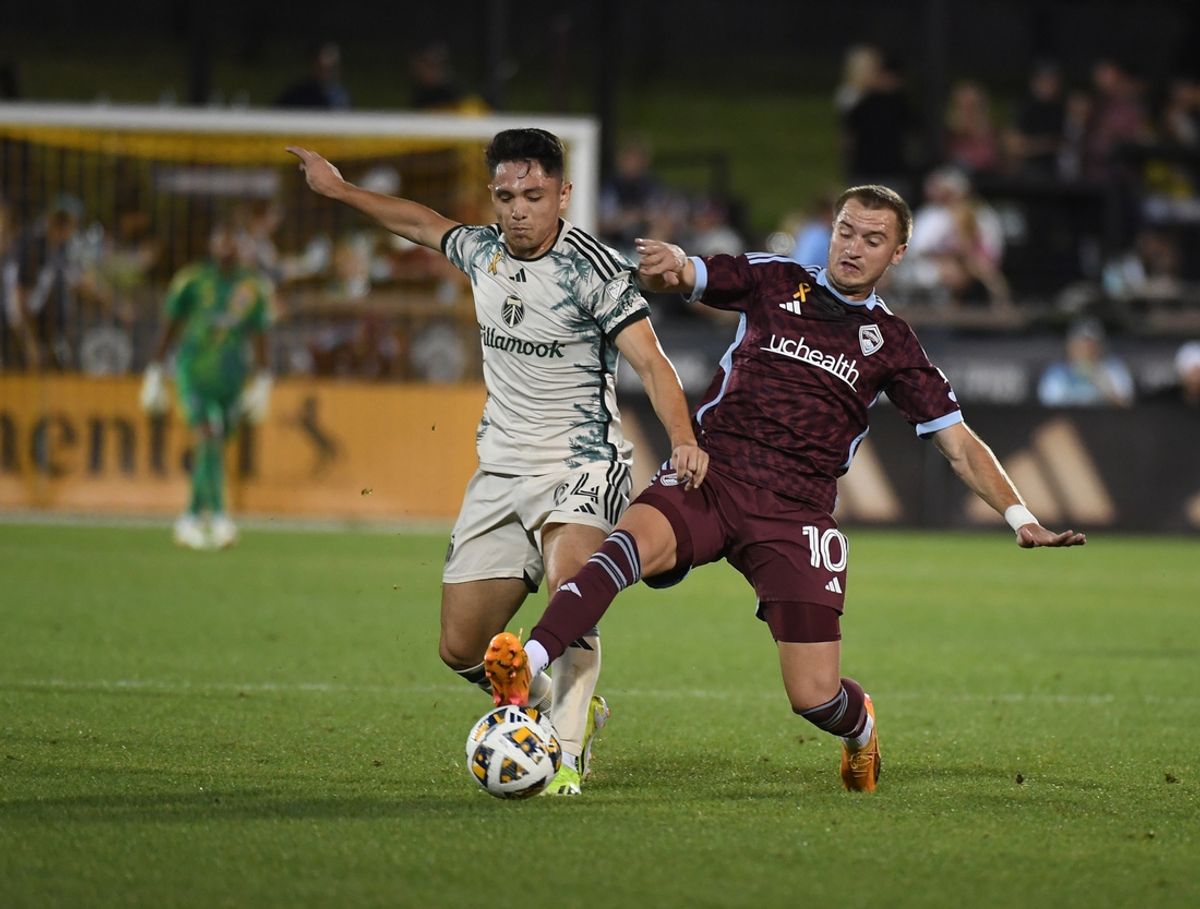 Sep 14, 2024; Commerce City, Colorado, USA; Portland Timbers midfielder David Ayala (24) battles Colorado Rapids midfielder Djordje Mihailovic (10) for control of a ball during the second half at Dick's Sporting Goods Park. Mandatory Credit: Christopher Hanewinckel-Imagn Images