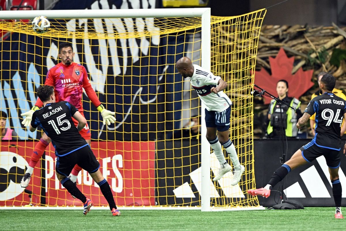 Sep 14, 2024; Vancouver, British Columbia, CAN; Vancouver Whitecaps FC forward Fafa Picault (11) heads the ball against San Jose Earthquakes goalkeeper Daniel (42) and defender Tanner Beason (15) in the second half at BC Place. Mandatory Credit: Anne-Marie Sorvin-Imagn Images